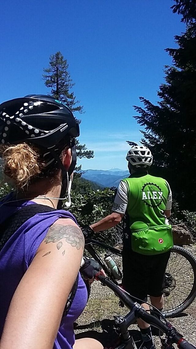 Almost 17 miles into the ride and the climbing was finally starting to pay off. We got our first long range views, including this peek at a peak. Mt. Mcloughlin is just above Dan's left shoulder.