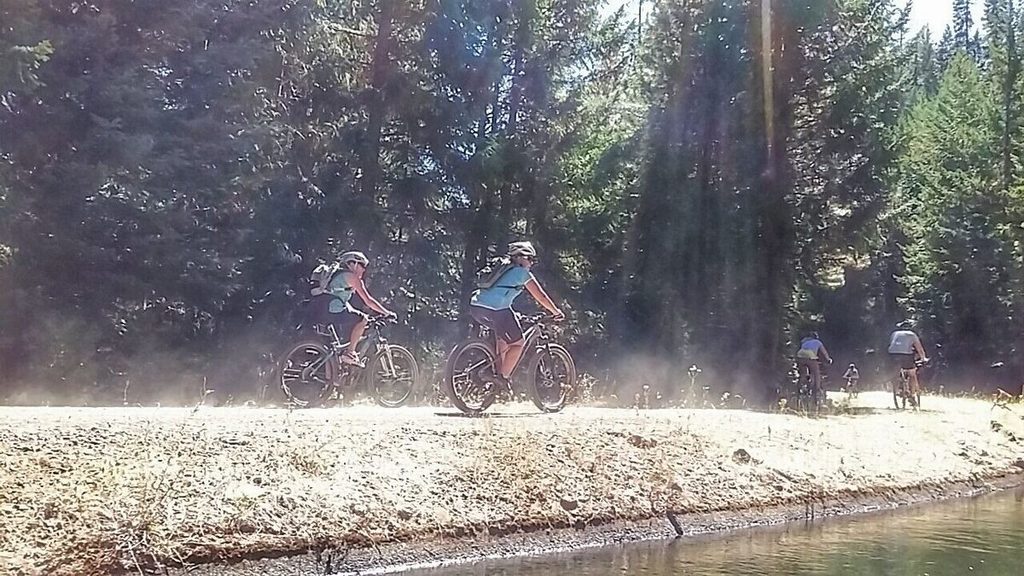 Gaps between riders were important on the dusty portions of the road. Kate, Annie, Julie and Travis follow Nicole around the corner. Jen dusted all of us.
